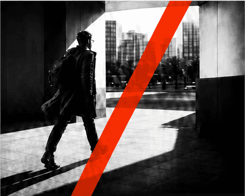 A person walking decisively through a modern city space