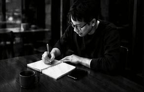 A person turning an intention into a written first step